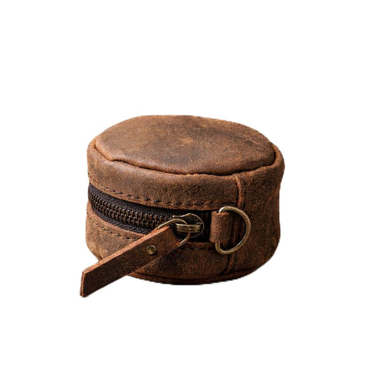 RUGS MADE Vintage leather-covered pouch reinforced stitching, and metal D-ring attachments, designed for outdoor, military, or travel use